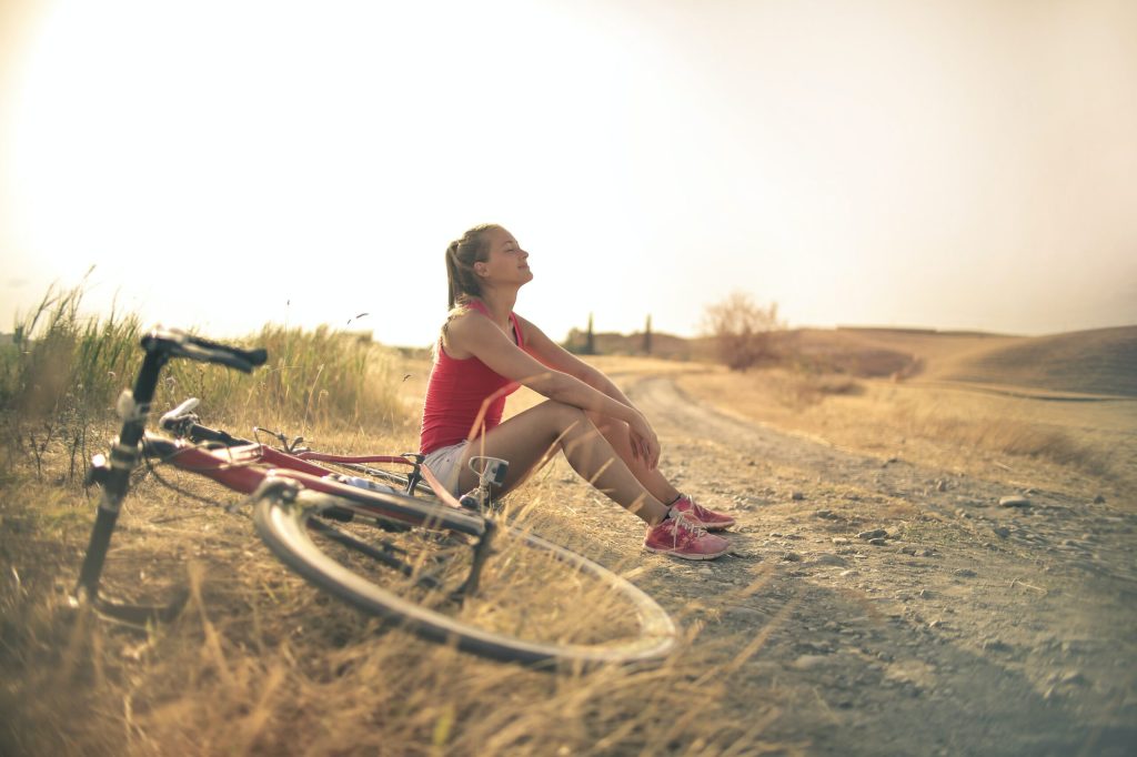 Girl taking a break from exercise to try to alleviate anxiety naturally