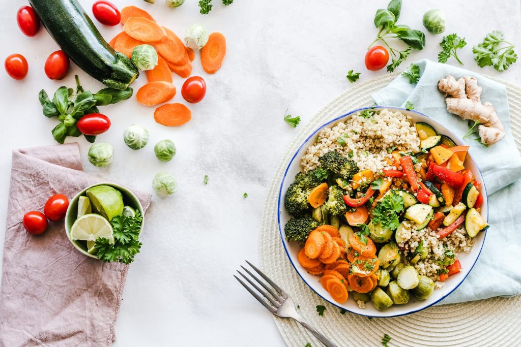 Picture of a salad and vegetables that is meant to improve your mood with food