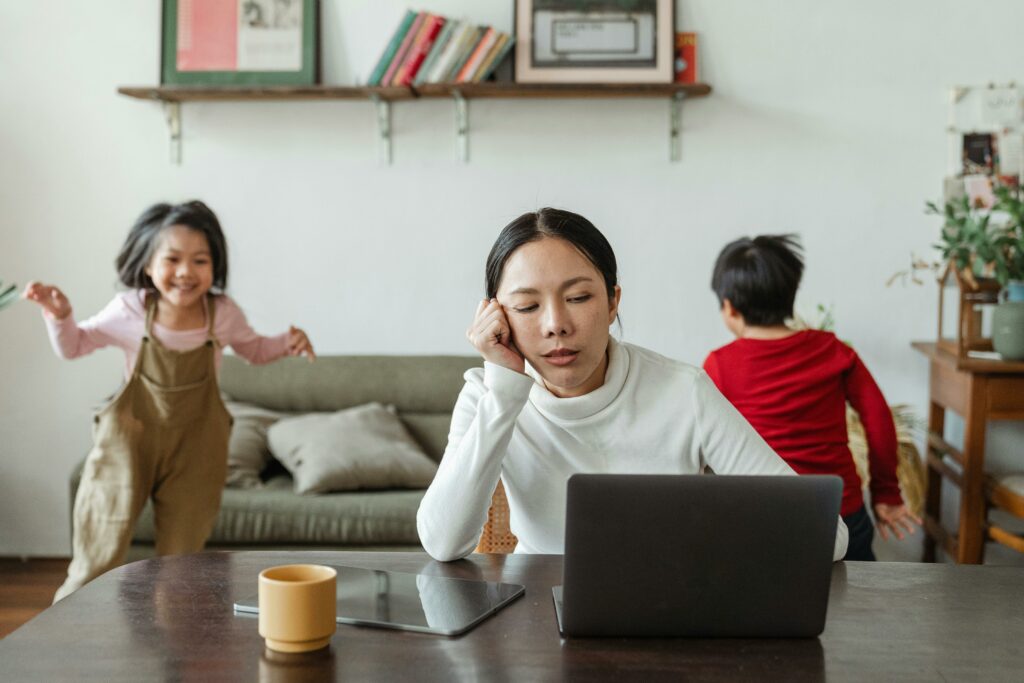 Mother with children suffering from decision fatigue and considering therapy for stress management