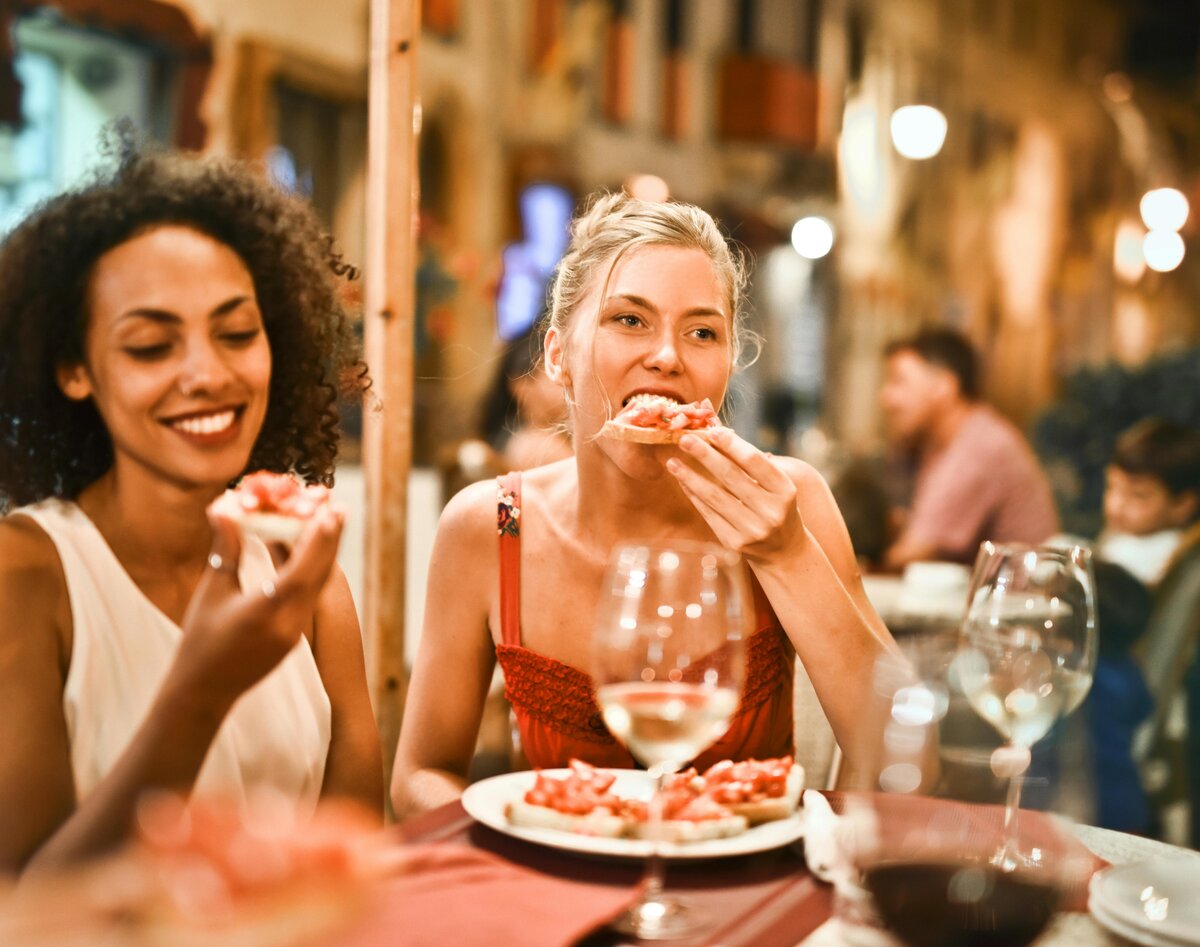 People enjoying eating after eating disorder therapy